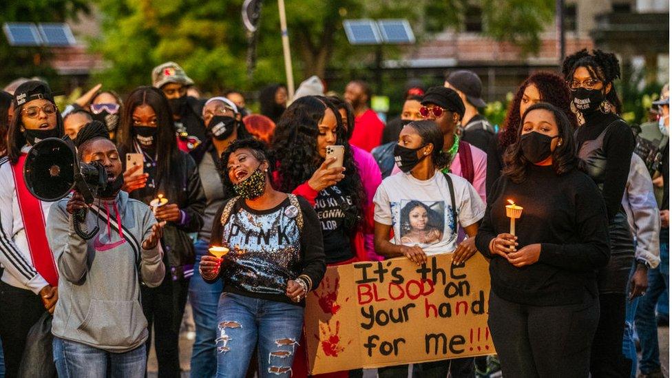 Protesters at a 2020 vigil for Breonna Taylor