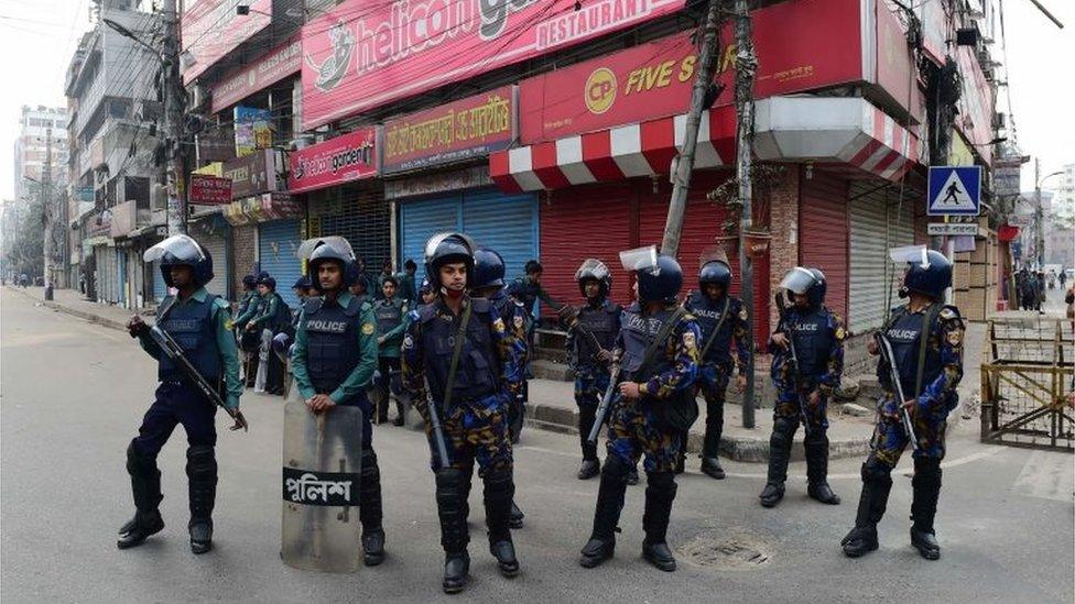 Bangladesh police stand guard in Dhaka following a verdict in the corruption case of Bangladesh"s main opposition leader and Bangladesh Nationalist Party chairperson Khaleda Zia in Dhaka on February 8, 2018.