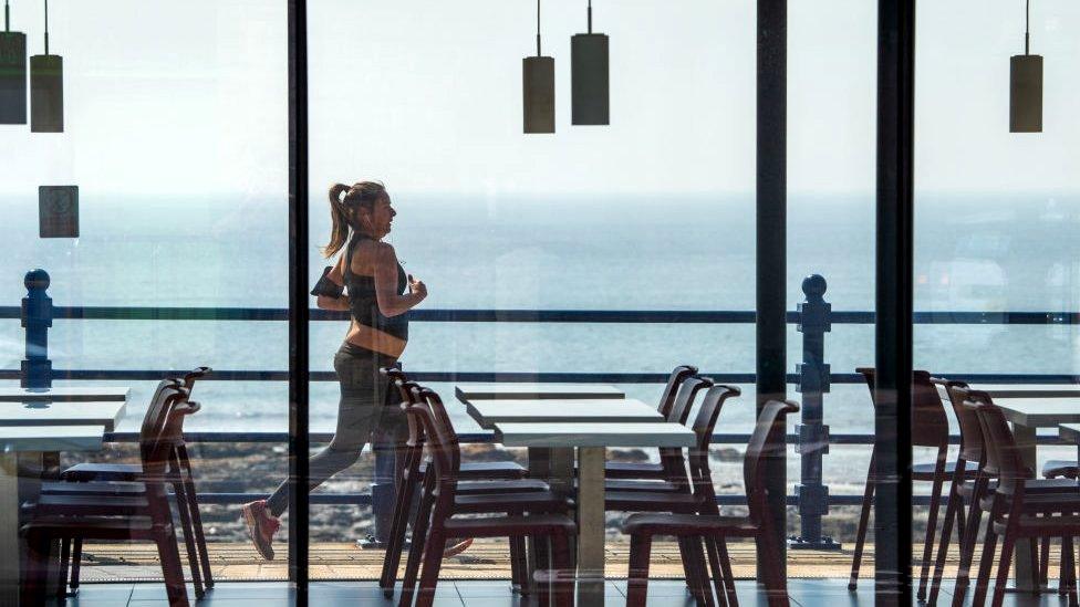 A woman exercises in Porthcawl