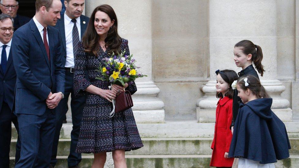 The couple were welcomed by French children