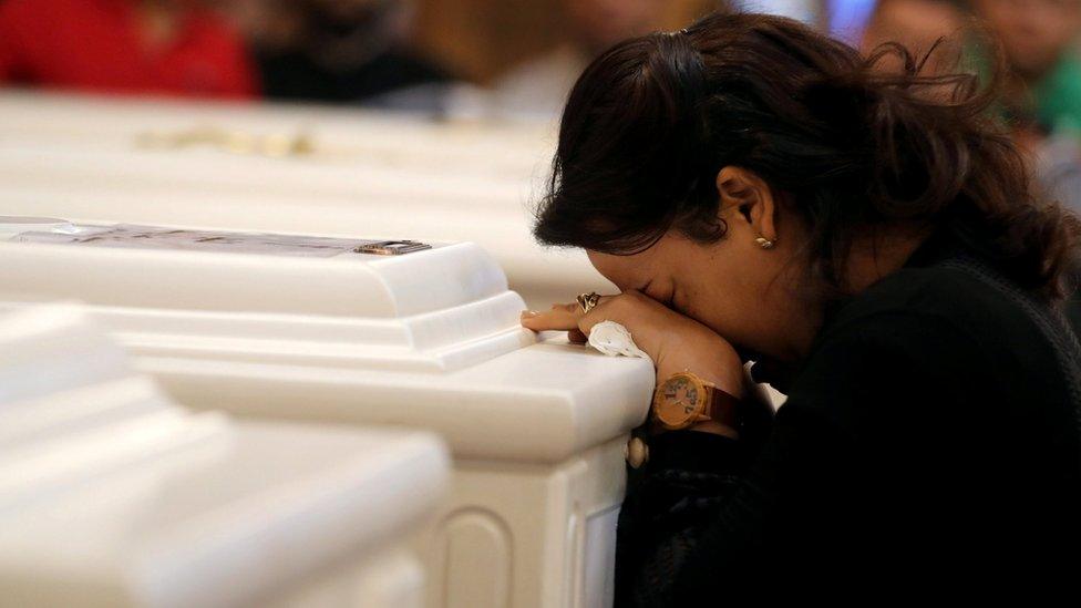 A relative of victims of an attack on a group of Coptic Christians attends a funeral, at the Prince Tadros Church in Minya, Egypt, November 3, 2018