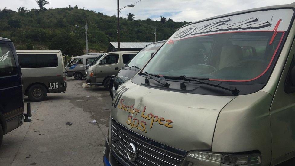 Mini buses parked at a station in Lopez Arellano in Honduras.