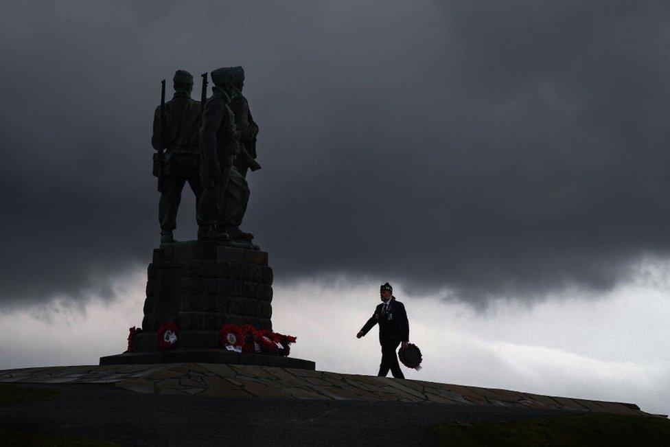 A member of the military lays a wreath at Commando Memorial to commemorate and pay respect to the sacrifice of service men and women who fought in the two World Wars and subsequent conflicts in Spean Bridge, Scotland, 8 November 2020.