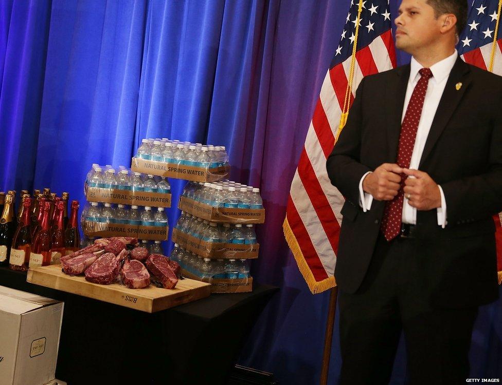 Donald Trump steak guarded by security at a press conference at the Trump National Golf Club Jupiter on March 8, 2016 in Jupiter, Florida