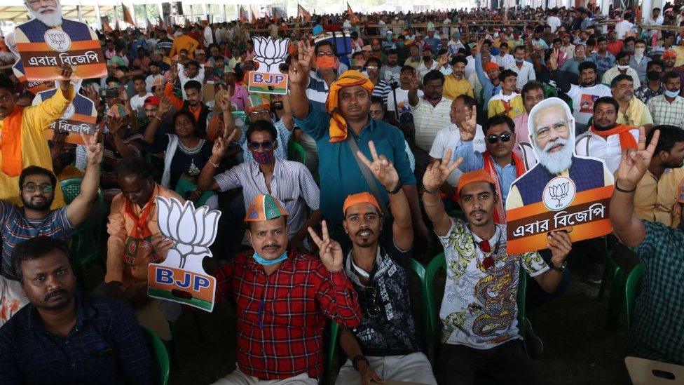 A crowd - mainly without masks - at a BJP rally