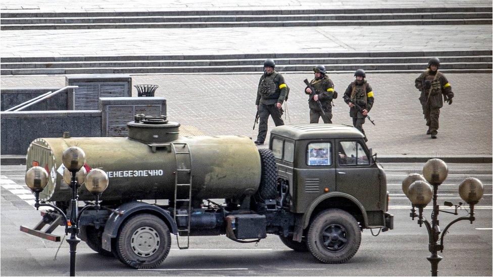 Ukrainian servicemen patrol during a curfew as Russian forces continue to advance on the third day in Kyiv, Ukraine, on 27 February 2022