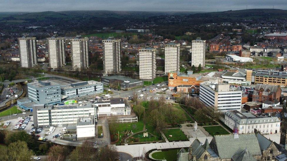 An aerial photograph taken by drone of the town of Rochdale showing the 'Seven Sisters' tower blocks