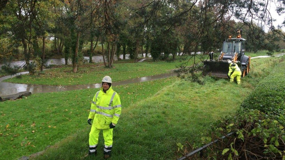 NRW staff working on flood defences in St Asaph