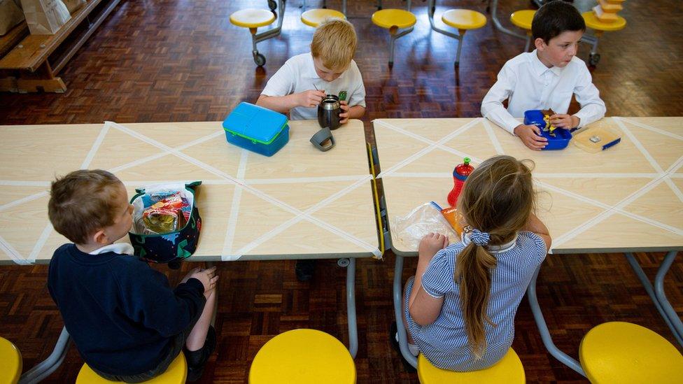 Photo dated 18 May of children eating lunch in segregated positions at Kempsey Primary School in Worcester.