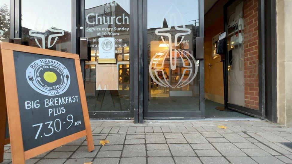 A café with a sign for breakfast out front