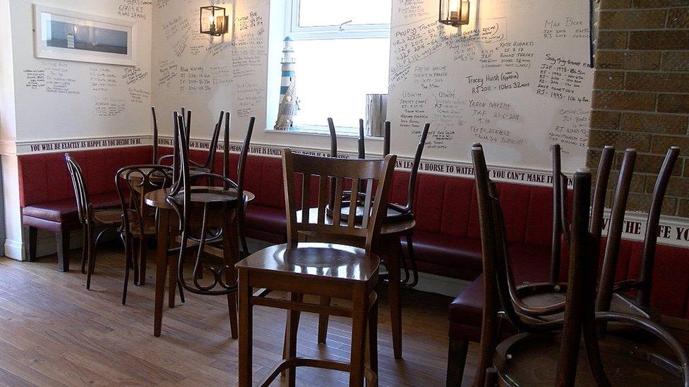 Chairs on tables in a pub