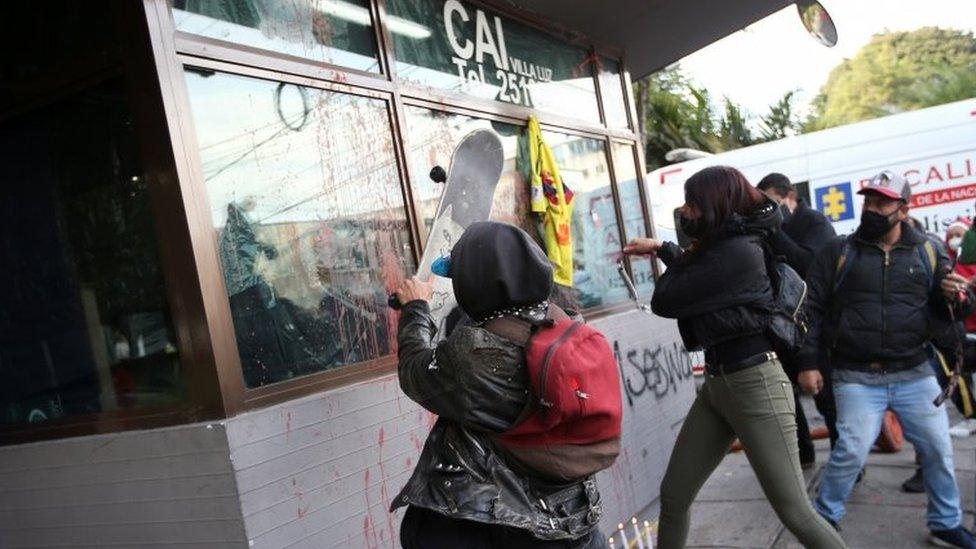 People protest outside a police station after a man, who was detained for violating social distancing rules, died from being repeatedly shocked with a stun gun by officers, according to authorities, in Bogota, Colombia September 9, 2020.