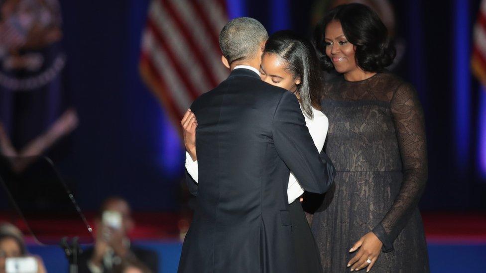 Barak Obama hugging his family