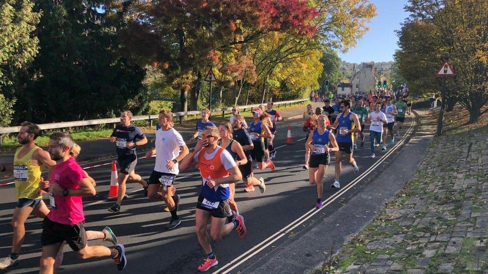 People running near trees