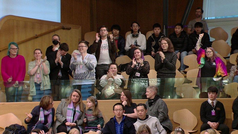 Cheering supporters in parliament