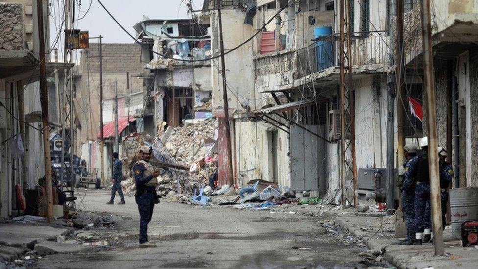 An Iraqi Federal Police member stands on a street in Mosul, Iraq, on 2 April, 2017.