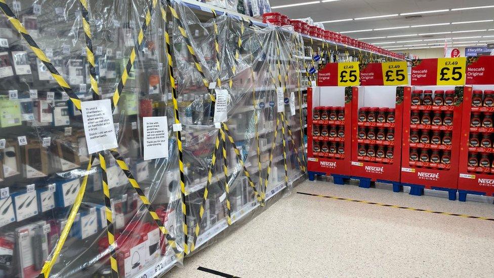 Electrical products taped up in a Tesco store in Penarth, Vale of Glamorgan