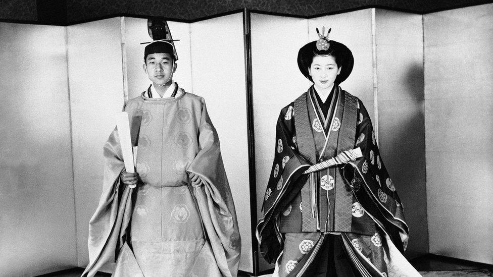 Akihito, left, and his bride Michiko Shoda, who became Princess Michiko pose in the ceremonial robes they wore during wedding ceremony in Shinto temple on the Tokyo Imperial Palace grounds, April 1959