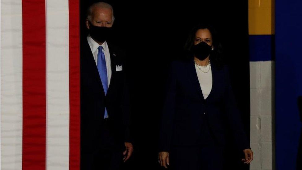 Democratic presidential candidate and former Vice President Joe Biden; and vice presidential candidate Senator Kamala Harris take the stage at a campaign event, their first joint appearance since Biden named Harris as his running mate, at Alexis Dupont High School in Wilmington, Delaware, U.S., August 12, 2020.