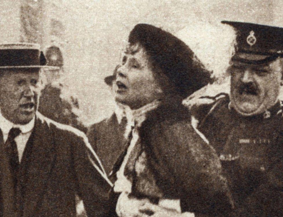 Emmeline Pankhurst being arrested outside Buckingham Palace