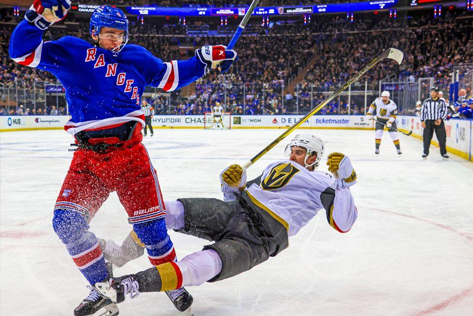 Braden Schneider of the New York Rangers hits Brett Howden of the Vegas Golden Knights during the third period of their NHL game at Madison Square Garden in New York City