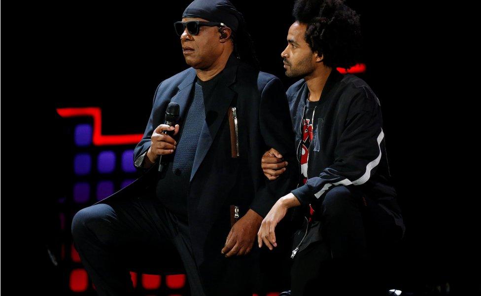 Singer Stevie Wonder takes a knee before performing at the 2017 Global Citizens Festival at Central Park in New York, U.S., September 23, 2017