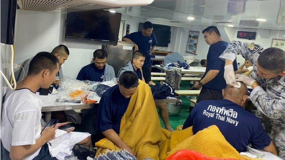 Crew members from the capsized HTMS Sukhothai warship receive medical treatment in the Gulf of Thailand, December 18, 2022. Royal Thai Navy/Handout via REUTERS