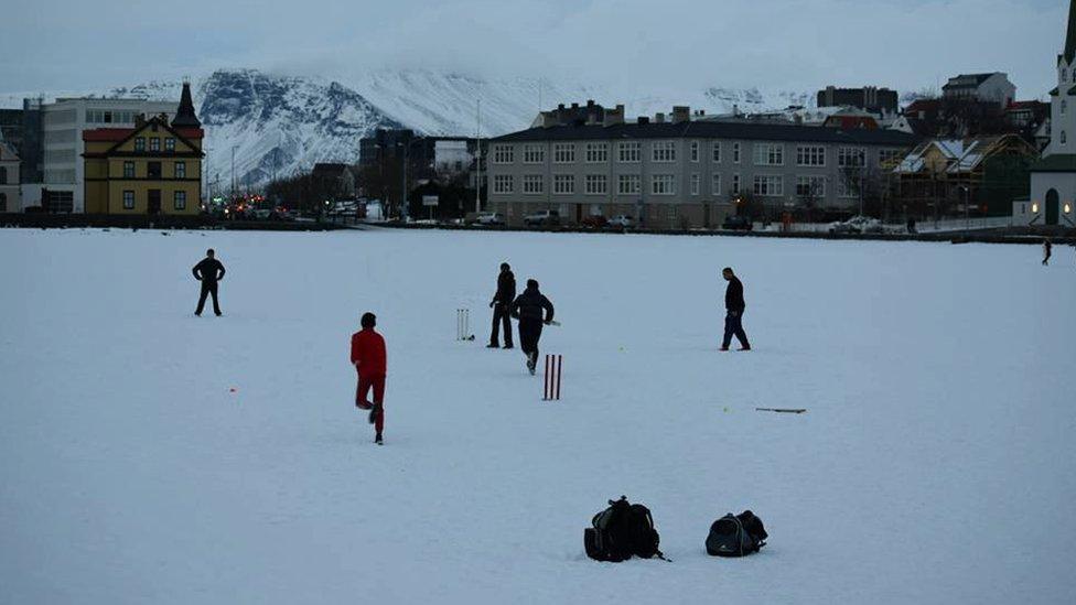 Icelandic cricketers playing on a snowy pitch