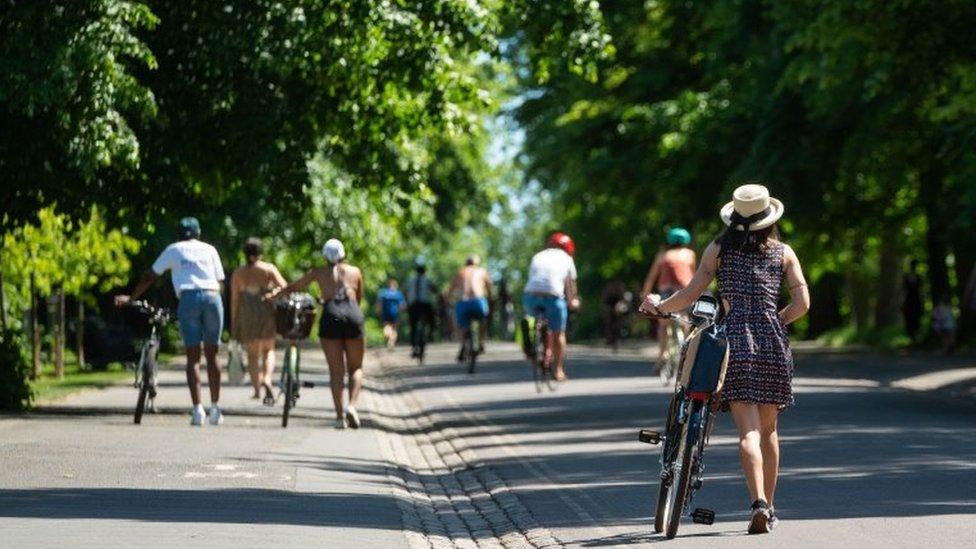 People enjoy the hot weather in Greenwich Park, London on 20 May