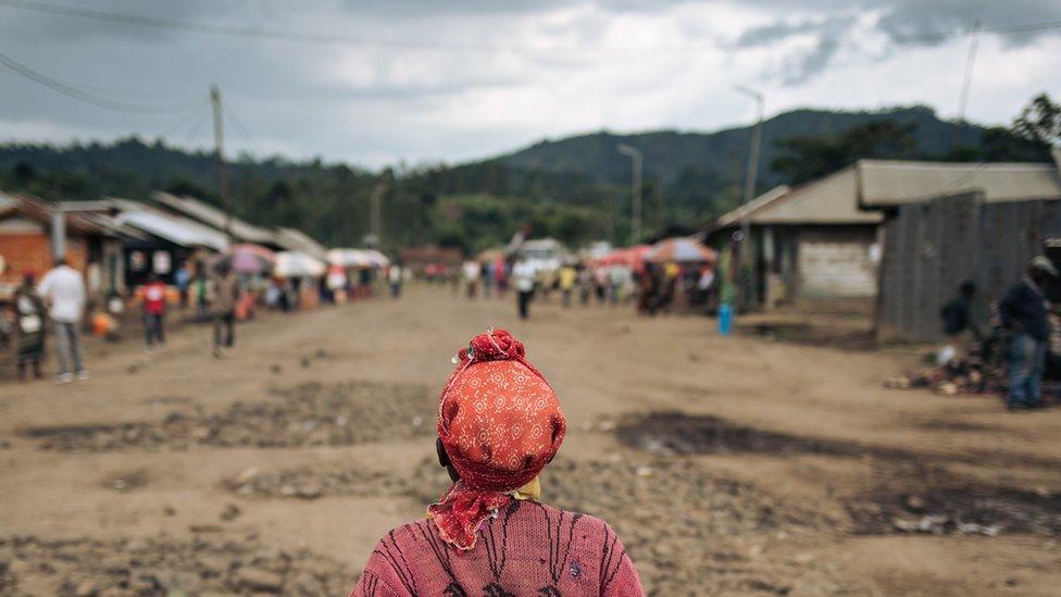 A woman crosses the Mweso market, Masisi Territory, eastern Democratic Republic of the Congo