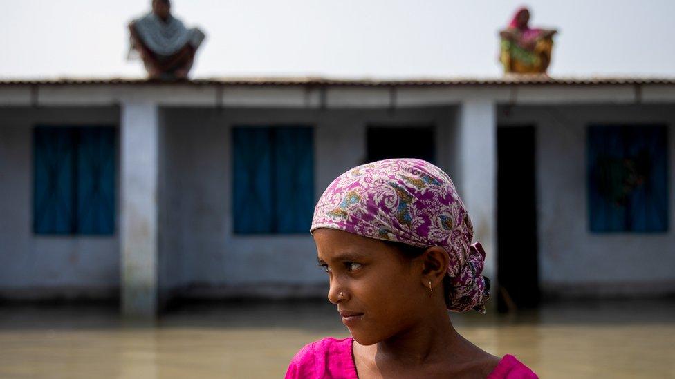 A-flood-affected-girl-outside-a-house-in-Bangladesh.