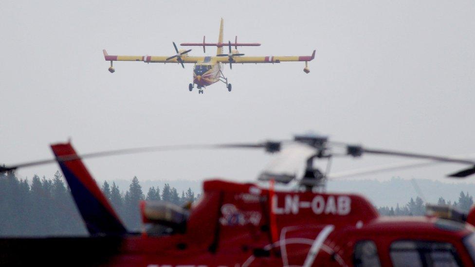 A French Bombardier 415 firefighting aircraft lands on the tarmac in Sveg, central Sweden on July 21, 2018 to help battle a 200 sq.km large wildfire that has been raging for more than a week