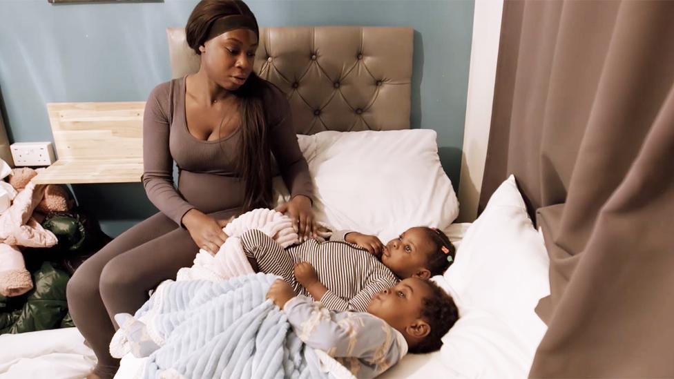 Jonelle puts her children to bed