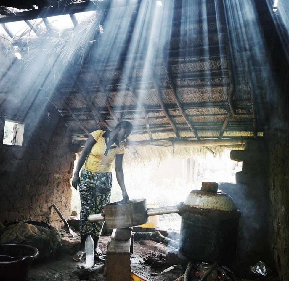 Light streams into a woman's house.