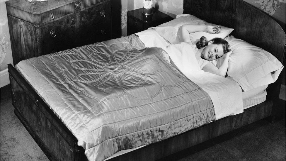 woman lying in bed