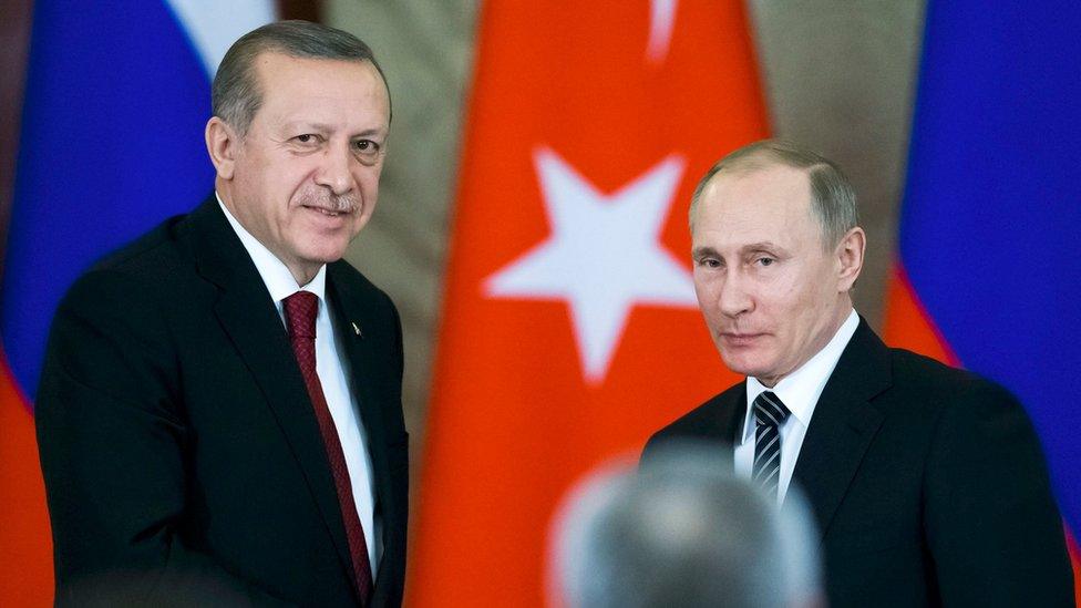 Russian President Vladimir Putin (R) shakes hands with his Turkish counterpart Recep Tayyip Erdogan after talks at the Kremlin in Moscow, Russia, on 10 March 2017