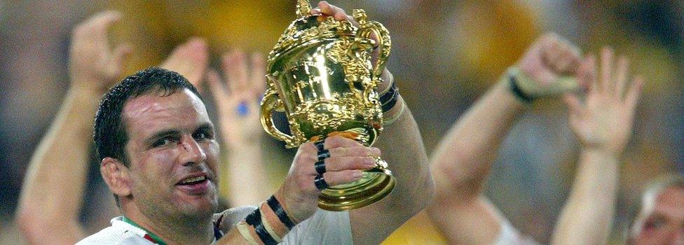 Martin Johnson holds aloft the Webb Ellis Trophy as England celebrate winning the 2003 Rugby World Cup Final in Sydney, Australia