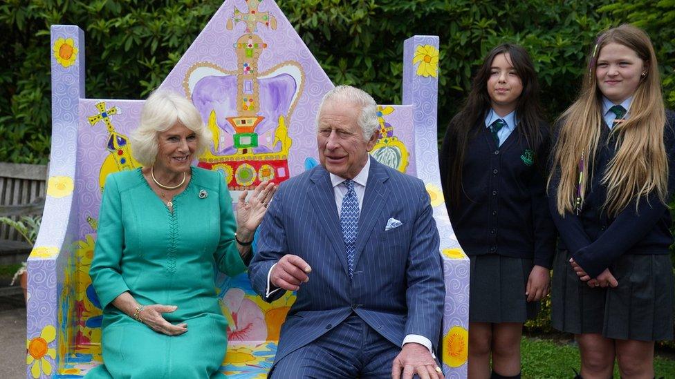 The couple meet pupils from Belfast's Blythefield Primary School at Hillsborough who have taken part in Historic Royal Palaces' competition to design Coronation benches