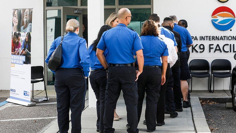 Federal workers line up at a pop-up food pantry in Tampa, Florida