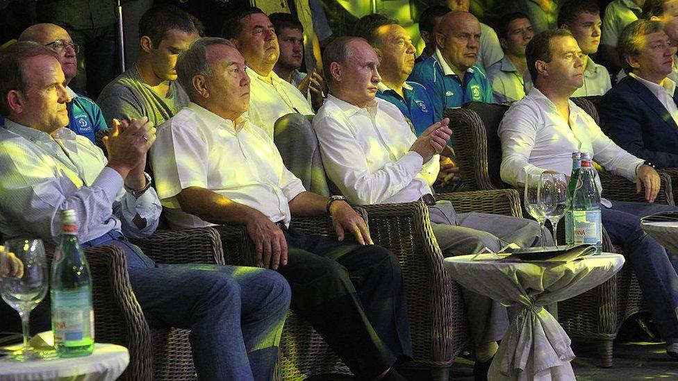 Russian President Vladimir Putin (C), Prime Minister Dmitry Medvedev (R), Ukrainian politician Viktor Medvedchuk (L) and Kazakh President Nursultan Nazarbayev (2L) seen during the League S-70 International Championship Fights in Plotforma club on August 17, 2013 in Sochi, Russia