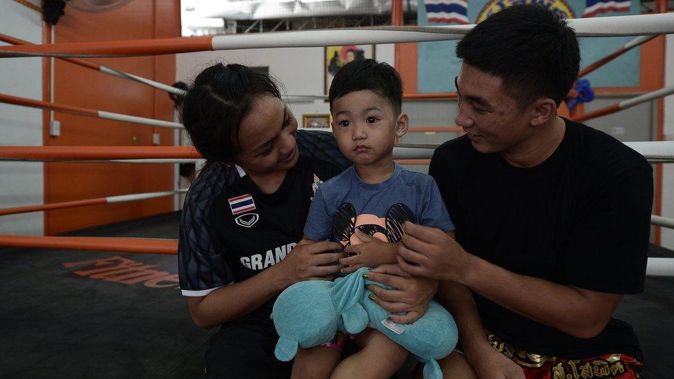 Ratchadaphon Winhantamma with her husband and son