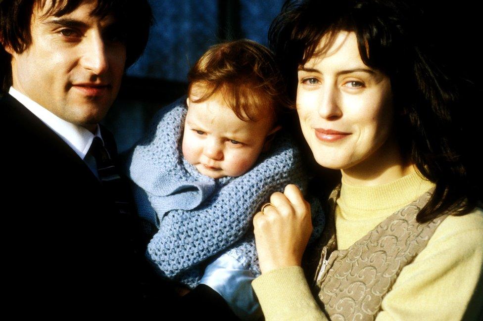 Mark Strong and Gina McKee with baby