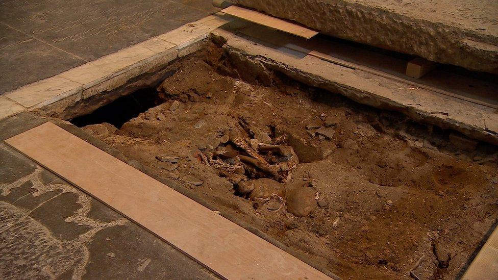 Human remains found beneath ledger stone in Gloucester Cathedral