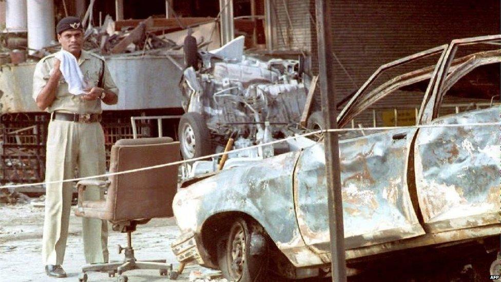 Indian police officer at scene of bombings in Mumbai, 1993