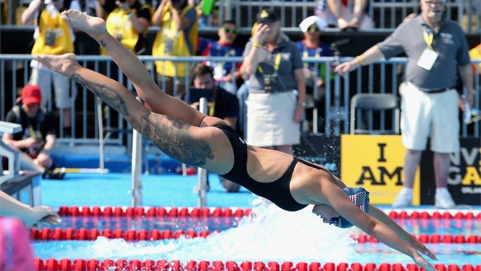 Elizabeth Marks dives into the pool