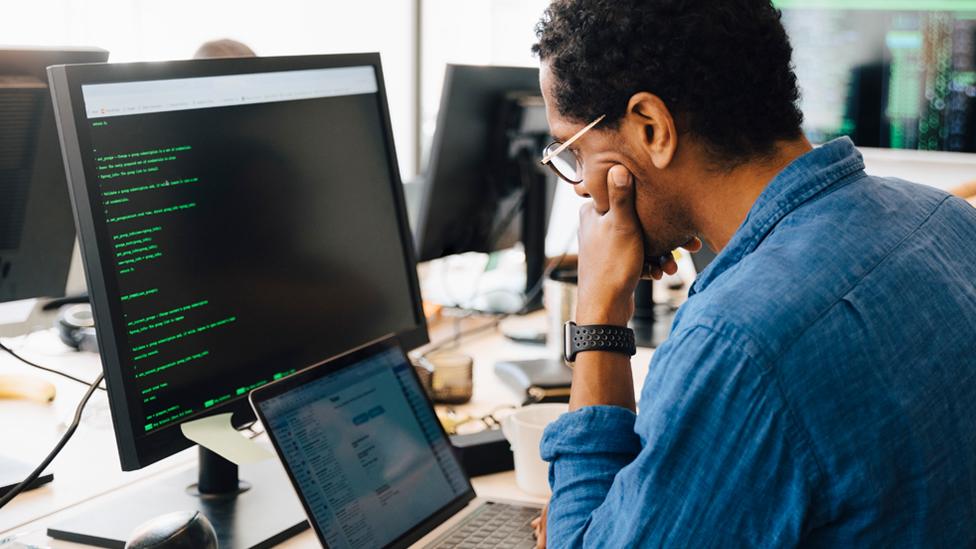 Stock image of a man using a computer