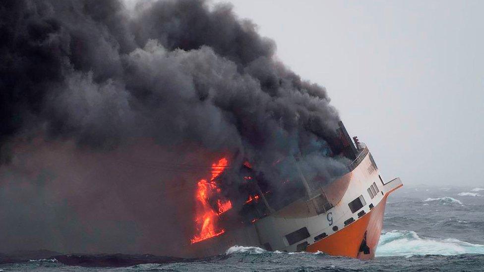 A handout picture released by the French Marine Nationale shows flames on the Italian merchant ship Grande America