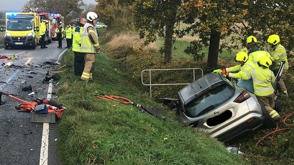 Firefighters at the scene of a crash