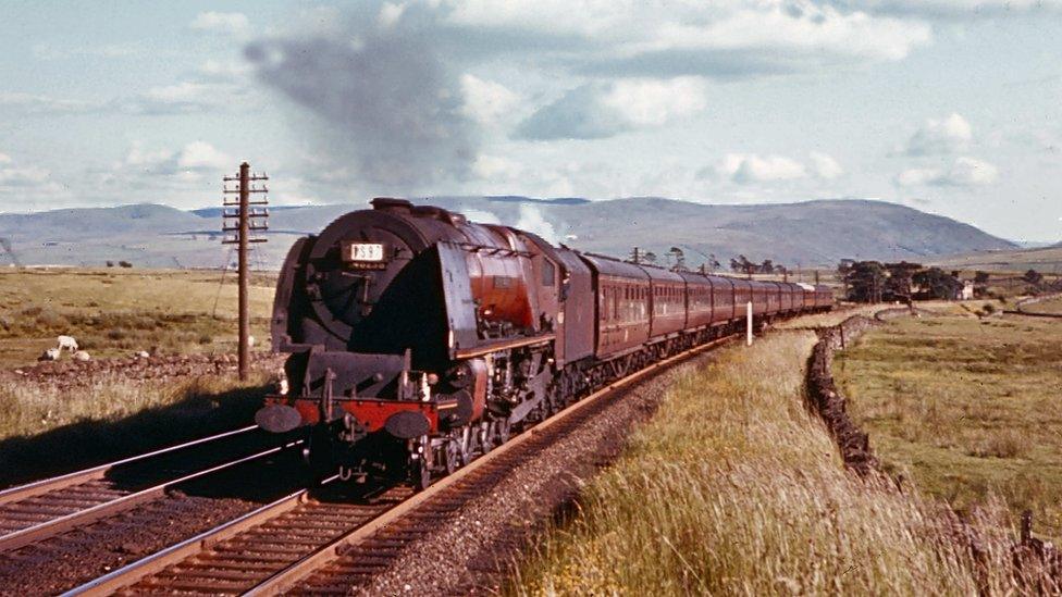 Colour picture of a train climbing Shap summit