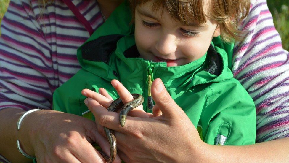 child with snake